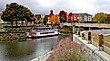 Frankenmuth, Michigan in the fall, with the iconic boat near the Bavarian Lodge and vibrant autumn colors in the background