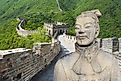 Ancient Chinese terracotta warrior against the Great Wall of China background