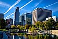 Omaha, NE - October 11, 2018: An evening view of the Omaha, Nebraska skyline from the Gene Leahy Mall. Editorial Role: Kristopher Kettner via Shutterstock.