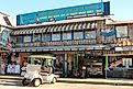 Shops and restaurants are open for business along the Gulf of Mexico waterfront in Cedar Key, Florida. Image credit Leigh Trail via Shutterstock