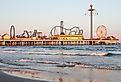 Galveston Island and beach with theme park on the pier. Image credit Carlos Bruzos Valin via Shutterstock.