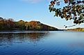 View of people kayaking in the fall on Lake Carnegie in Princeton, New Jersey. Editorial credit: EQRoy / Shutterstock.com