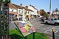 The Glastonbury Way information sign along Magdalene Street with town shops to the rear, Glastonbury, UK, via Caron Badkin / Shutterstock.com