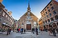 Front view of the majestic church Notre-Dame-des-Victoires in Place royale square in old Quebec. Editorial credit: iPIX Stock / Shutterstock.com