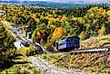 Cog railway steam train is returning from Mt. Washington tour with tourists, New Hampshire. Image credit Miro Vrlik Photography via Shutterstock