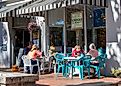 People enjoying a meal at Capers On The Square, a quaint eatery in Dahlonega, Georgia. Editorial credit: Jen Wolf / Shutterstock.com