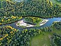 The scenic landscape of the Gauja River and surrounding forests in Latvia.