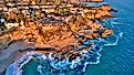 Aerial view of Three Arch Bay in Laguna Beach, Orange County, California during twilight.