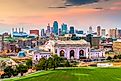 Kansas City, Missouri, USA downtown skyline with Union Station at dusk.