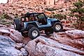 Moab, Utah, USA, September 17,2018:Black Rubicon Jeep on Moab Rim 4x4 off road Jeep trail. Editorial credit: Ogletree Photography / Shutterstock.com