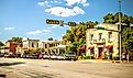 The Main Street in Fredericksburg, Texas, also known as "The Magic Mile," with retail stores and people walking. Editorial credit: ShengYing Lin / Shutterstock.com