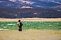 A fisherman fly fishing at the Antero Reservoir in Colorado. 