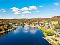 Colorful aerial view of Saranac Lake New York in the Adirondack Mountains during the fall.