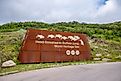 Entrance signage for the Head-Smashed-In Buffalo Jump World Heritage Site, via Jeff Whyte / Shutterstock.com