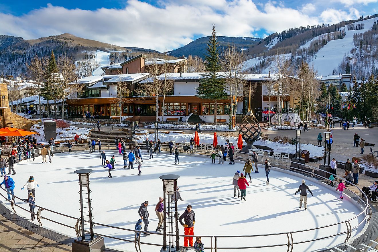 People walking on busy streets next to the skating rink in Vail, Colorado. Editorial credit: Margaret.Wiktor / Shutterstock.com.