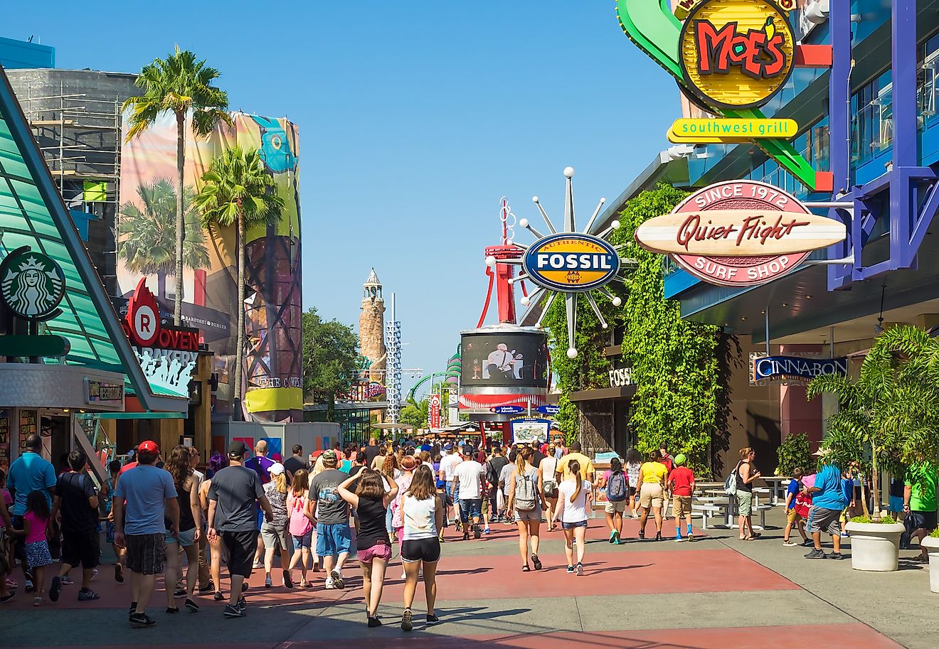 A crowd of visitors walking towards the entrance of the Universal Orlando Resort theme parks in Orlando, Florida.