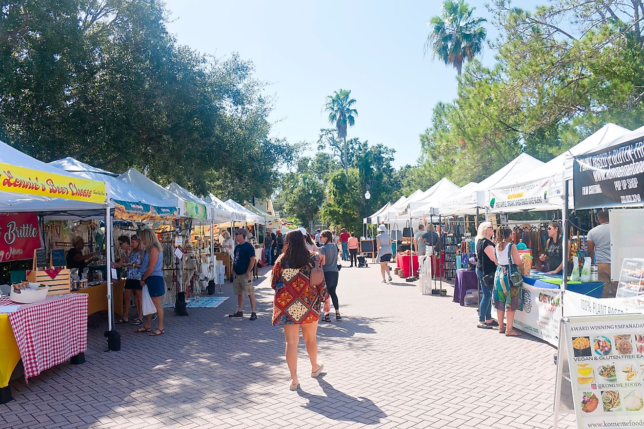 Historic downtown Dunedin, Florida: Market stalls at the Art Harvest one of the largest autumnal art shows in the Tampa Bay area., via Wicki58 / iStock.com