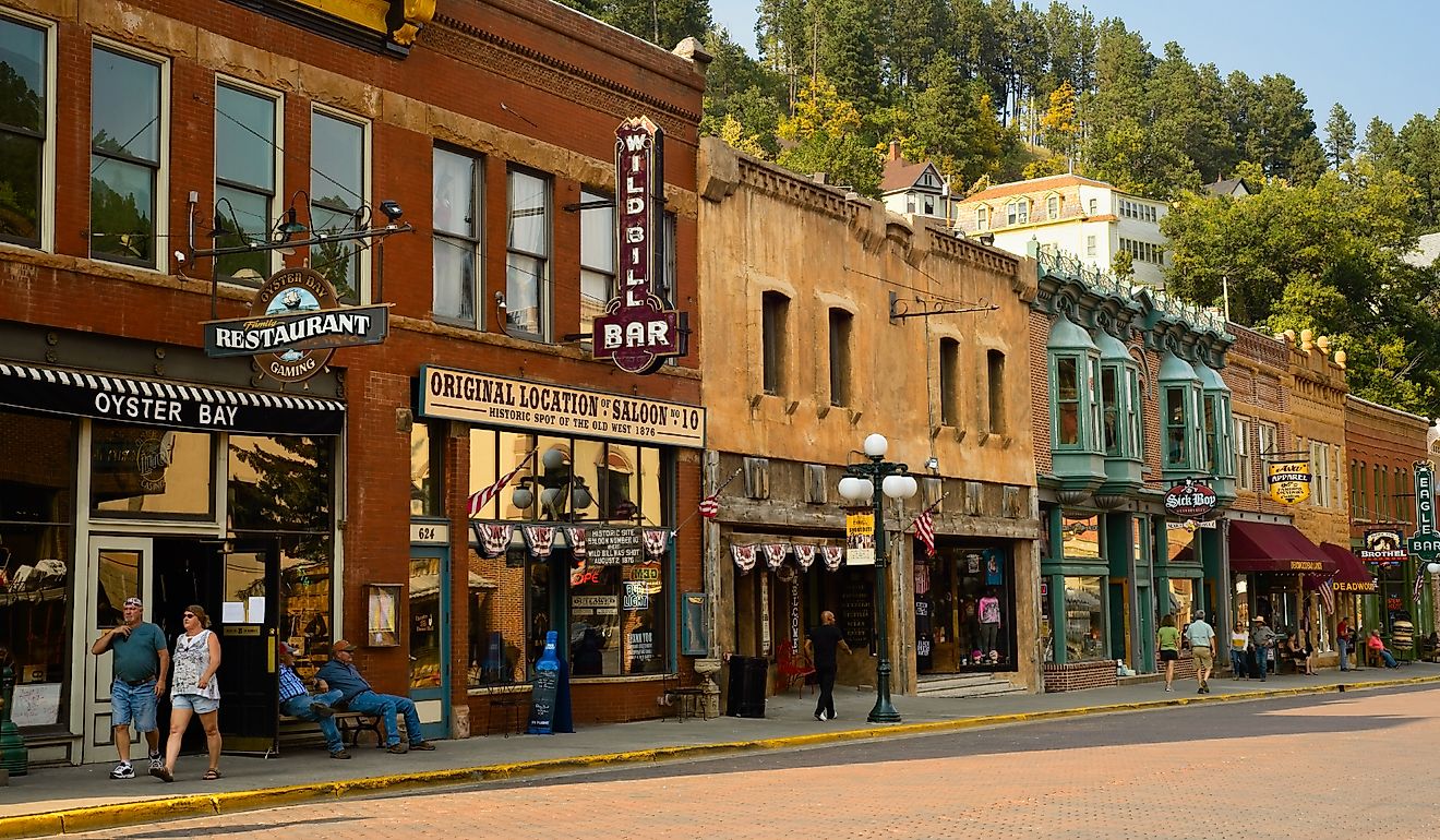 Historic saloons, bars, and shops bring visitors to Main St. in this Black Hills gold rush town of Deadwood, South Dakota, USA. Editorial credit: Kenneth Sponsler / Shutterstock.com