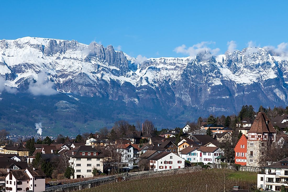 Vaduz, the capital city of Liechtenstein, sits between the Rhine River and the Alps.