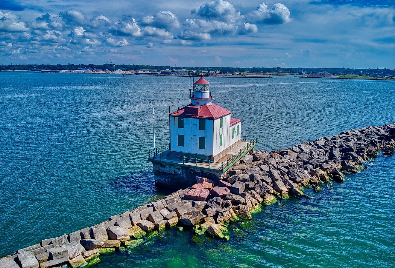 A drone shot of the Ashtabula Harbor Light building under a cloudy sky in Ohio, USA