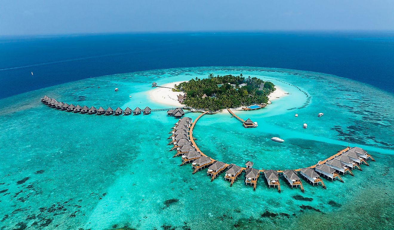 Aerial View, Maldives, North Malé Atoll, Indian Ocean, Thulhagiri Island Resort with Water Bungalows. Image credit Video Media Studio Europe via Shutterstock.