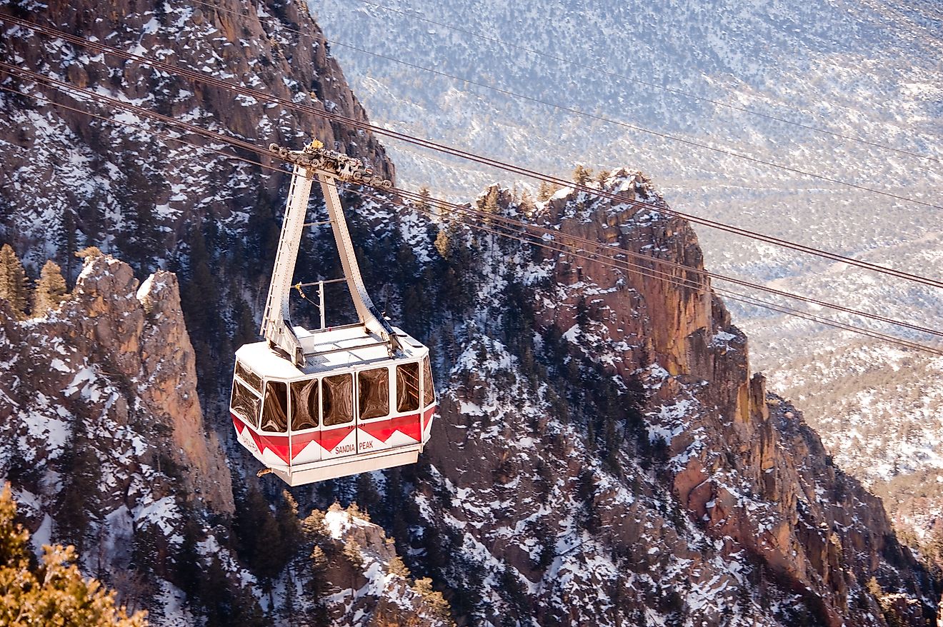 A gondola, on Sandia Peak Aerial Tramway, descends from the top in Albuquerque, New Mexico. Editorial credit: PICTOR PICTURES / Shutterstock.com