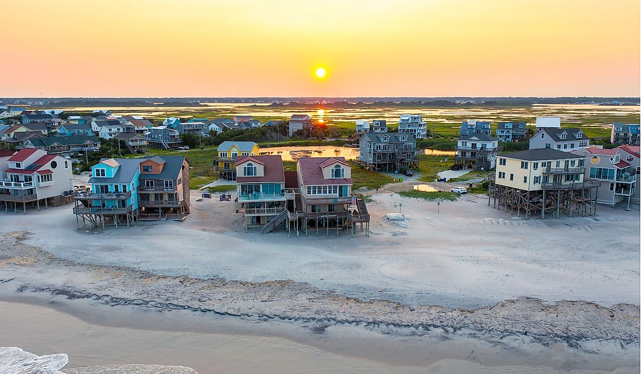 Aerial View of Beach Homes Right on the Shoreline in North Topsail Beach at Sunset. Editorial credit: Kyle J Little / Shutterstock.com