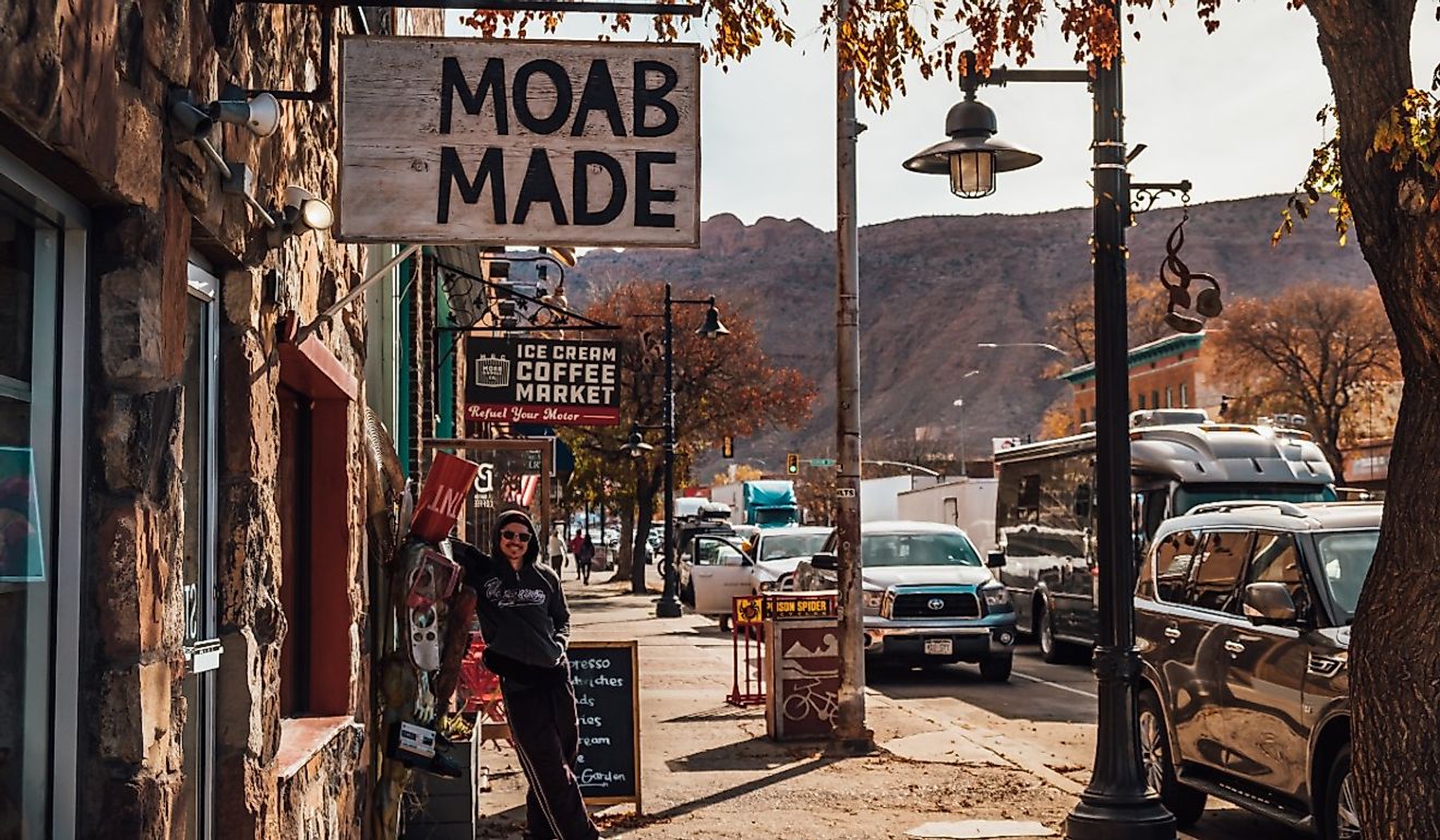 A man poses for a photo in downtown Moab, Utah.