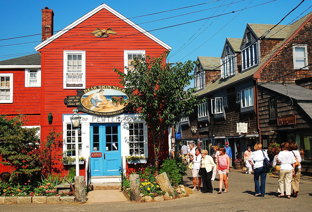 Folks stroll around the unique shops and boutiques on Bearskin Neck in Rockport, Massachusetts. Image credit James Kirkikis via Shutterstock