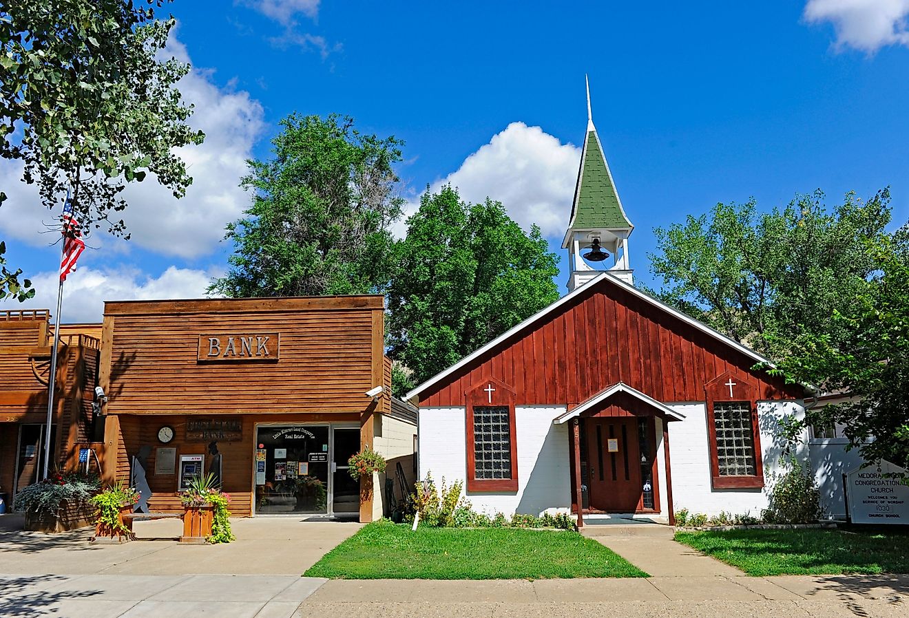 Church and bank in Medora, North Dakota. Image credit Dennis MacDonald via Shutterstock.
