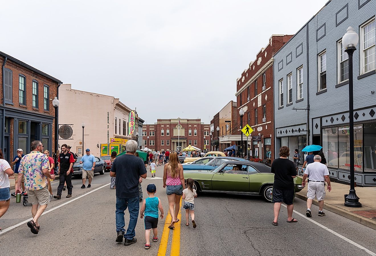 People walking the street during a car show in Elizabethtown, Kentucky. Image credit Brian Koellish via Shutterstock