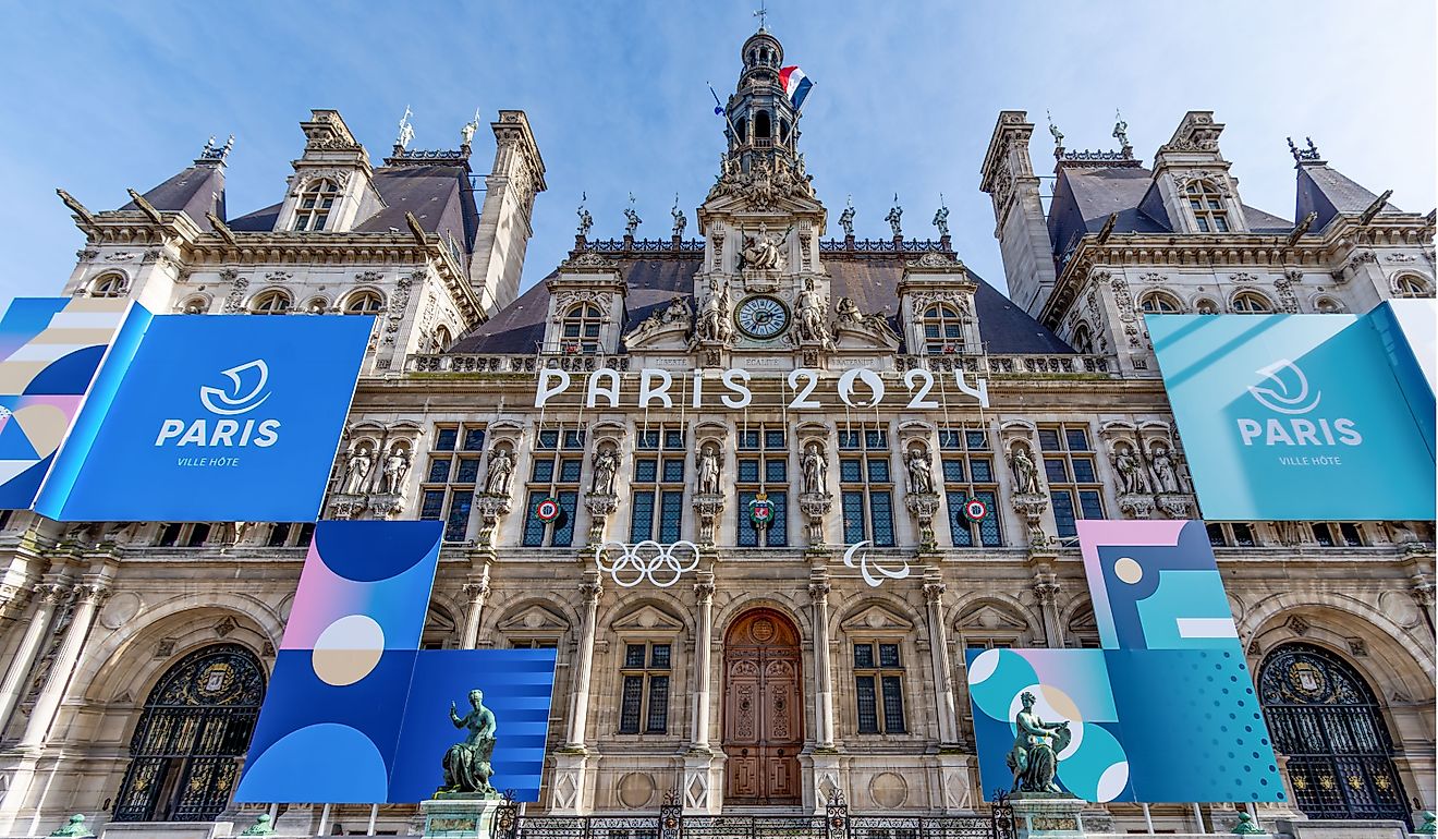 Facade of the town hall of Paris, France, decorated for the Olympic and Paralympic Games. Editorial credit: HJBC / Shutterstock.com