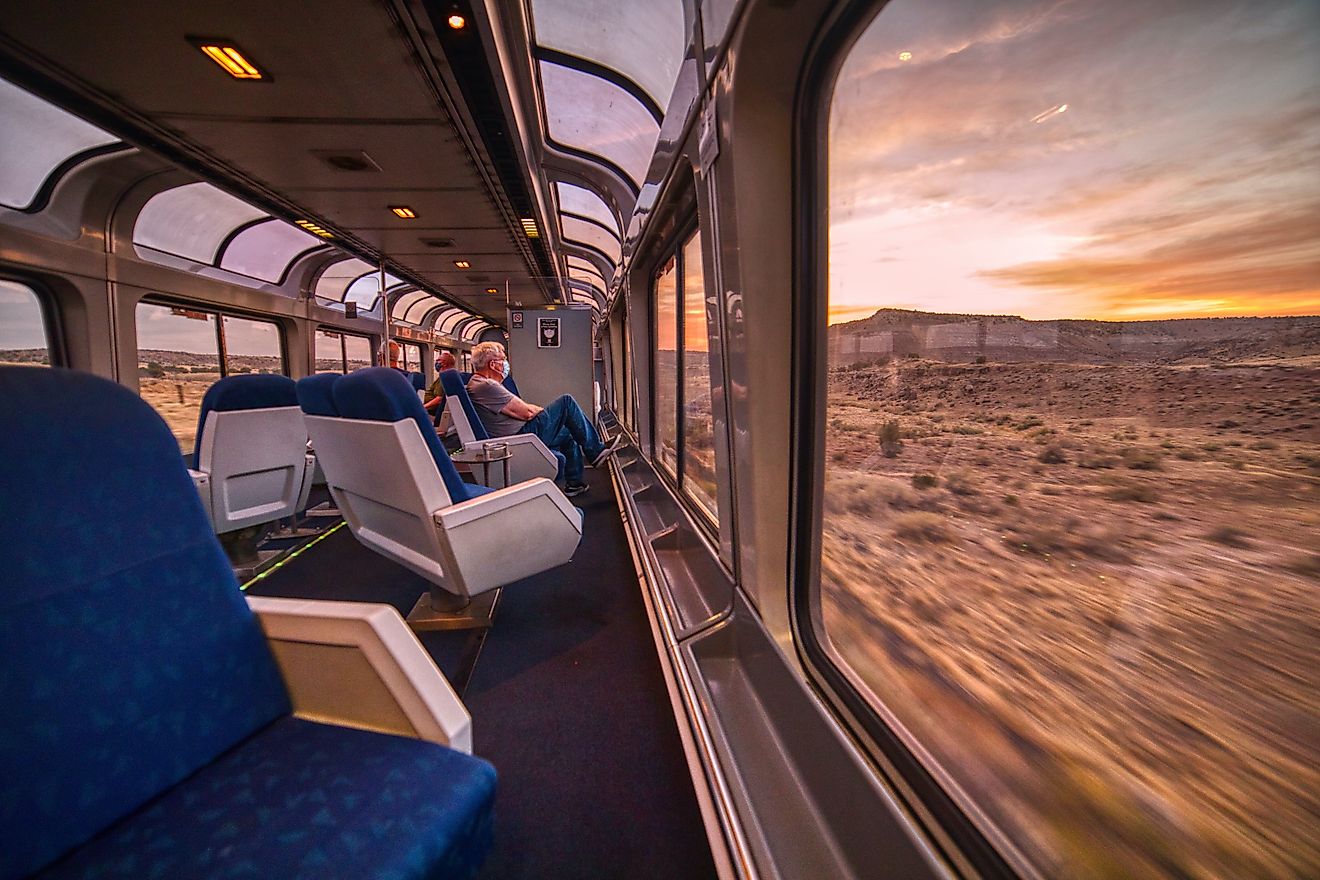 Amtrak train crossing through the Colorado Rocky Mountains, with peak fall colors, near Denver, Colorado. Editorial credit: Jacob Boomsma / Shutterstock.com