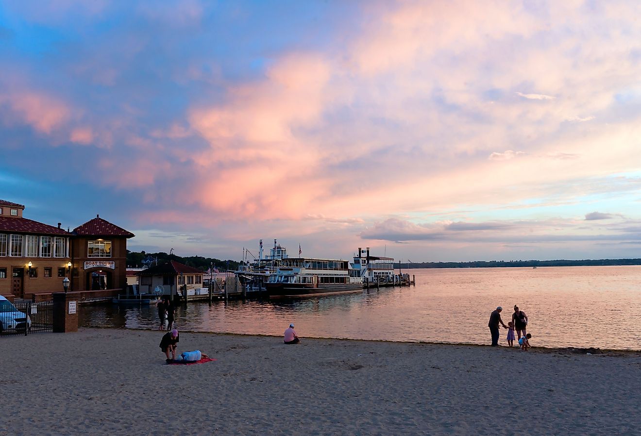 People gathering at the beach near Lake Geneva, Wisconsin. Image credit BetoVM via Shutterstock.