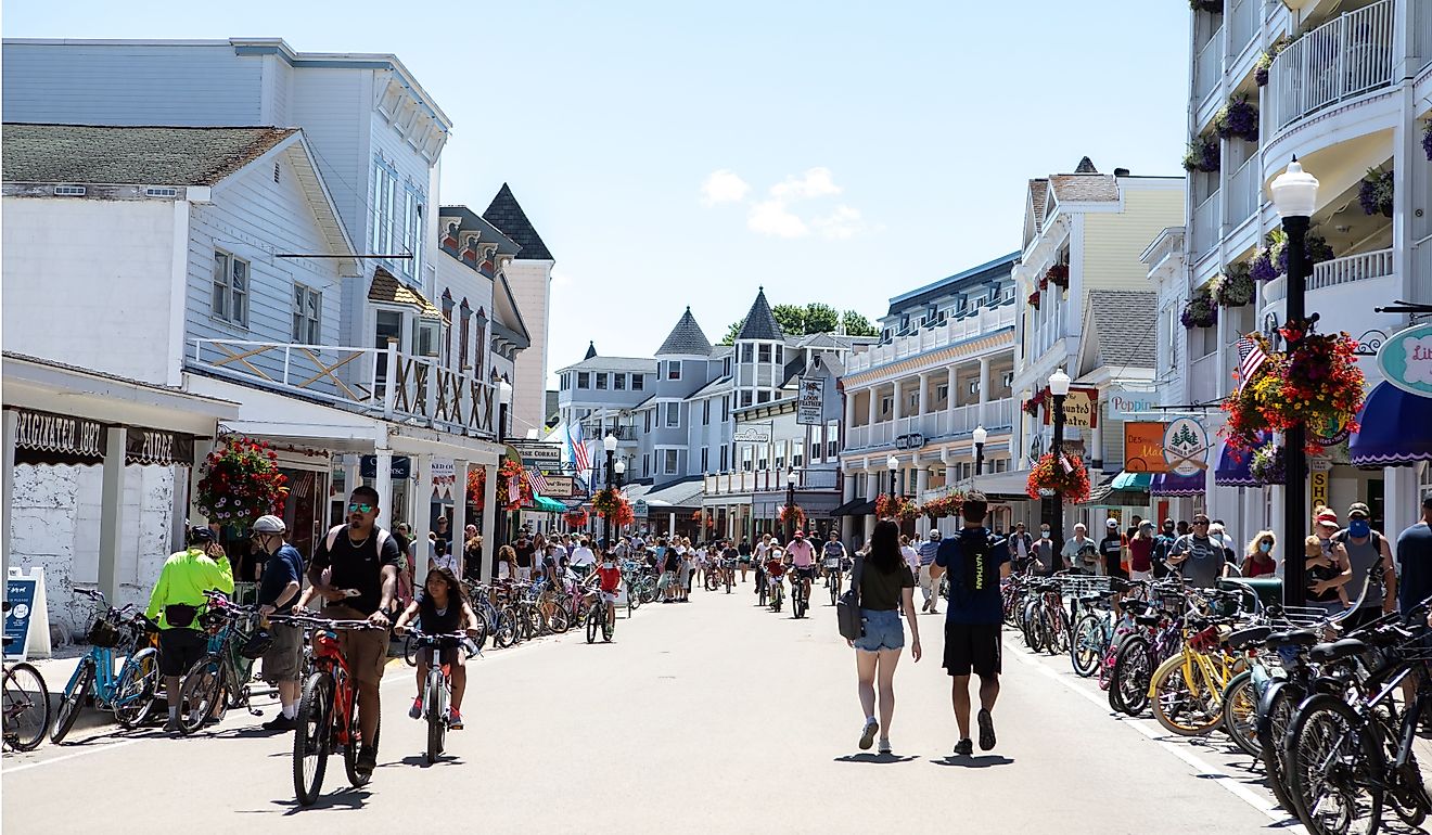 Tourists walking and bicycling on main street in Mackinac Island. Editorial credit: Cavan-Images / Shutterstock.com