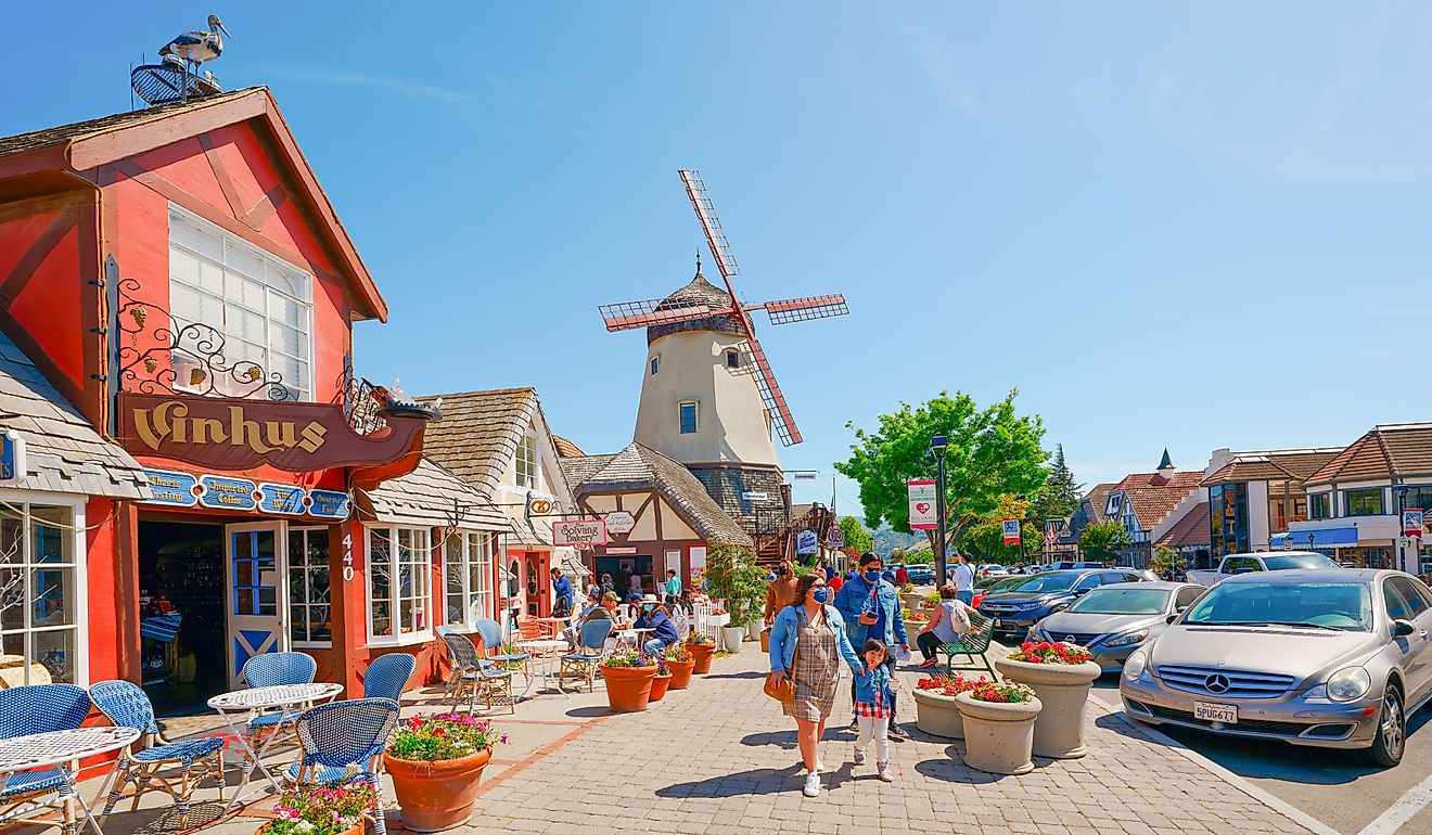  Main street, street view, and tourists in Solvang, beautiful small town in California. Editorial credit: HannaTor / Shutterstock.com