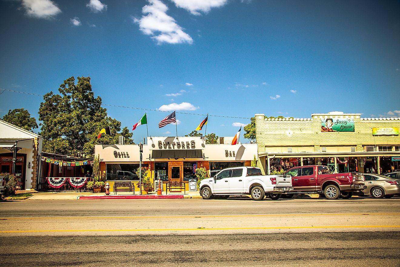 Main Street in Frederiksburg, Texas, also known as "The Magic Mile", with retail stores, via  ShengYing Lin / Shutterstock.com