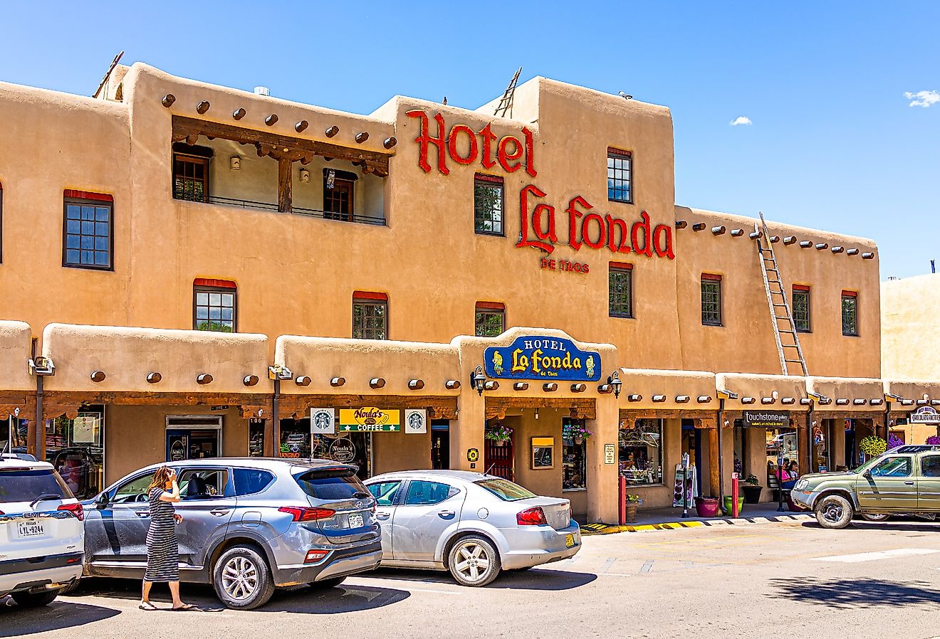 Downtown McCarthy's plaza square with sign exterior for Hotel La Fonda, Taos, New Mexico. Image credit Andriy Blokhin via Shutterstock