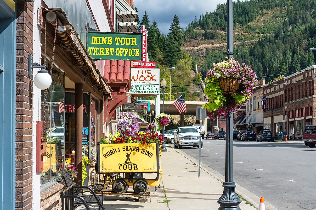 General view of the Sierra Silver Mine tour sign on a sidewalk in the historic mountain town of Wallace, Idaho