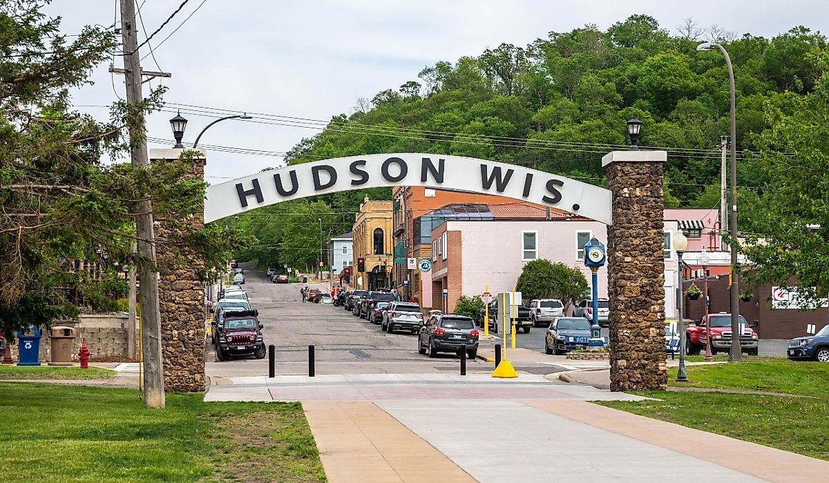 Sign and downtown street in Hudson, Wisconsin. Image credit Cheri Alguire via Shutterstock