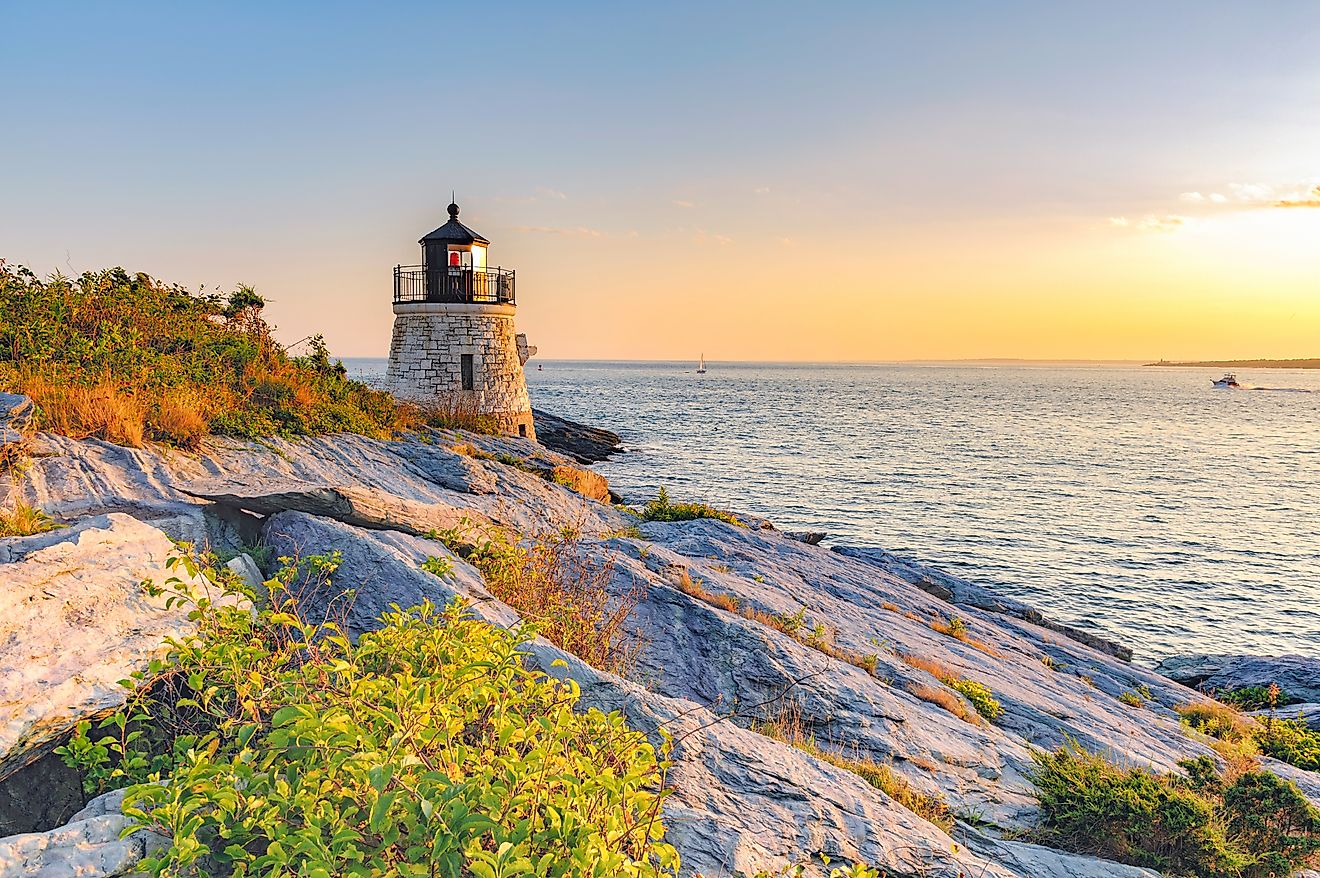 Castle Hill Lighthouse at twilight during the golden hour, just before sunset, in Newport, Rhode Island.