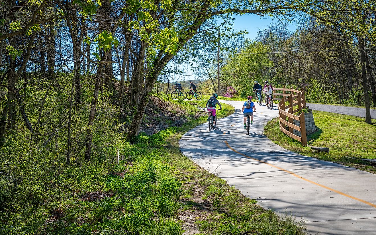 Family biking on a trail in Bella Vista, Northwest Arkansas.