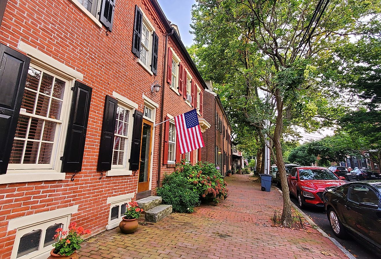 The row homes with American flags in the historic Old New Castle, Delaware. Image credit Khairil Azhar Junos via Shutterstock