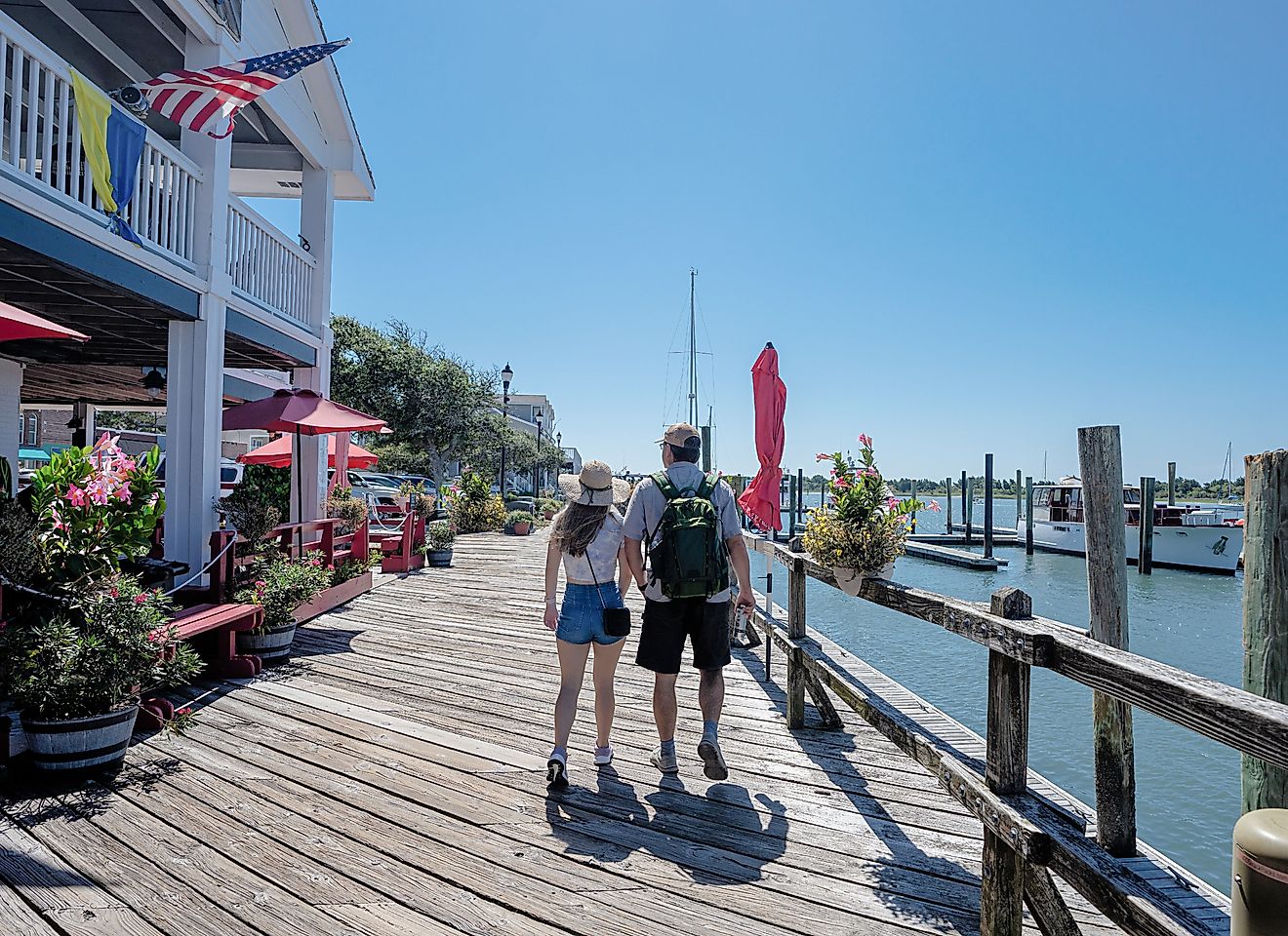 People walking on the boardwalk by the water. Inner Banks. Beaufort, North Carolin