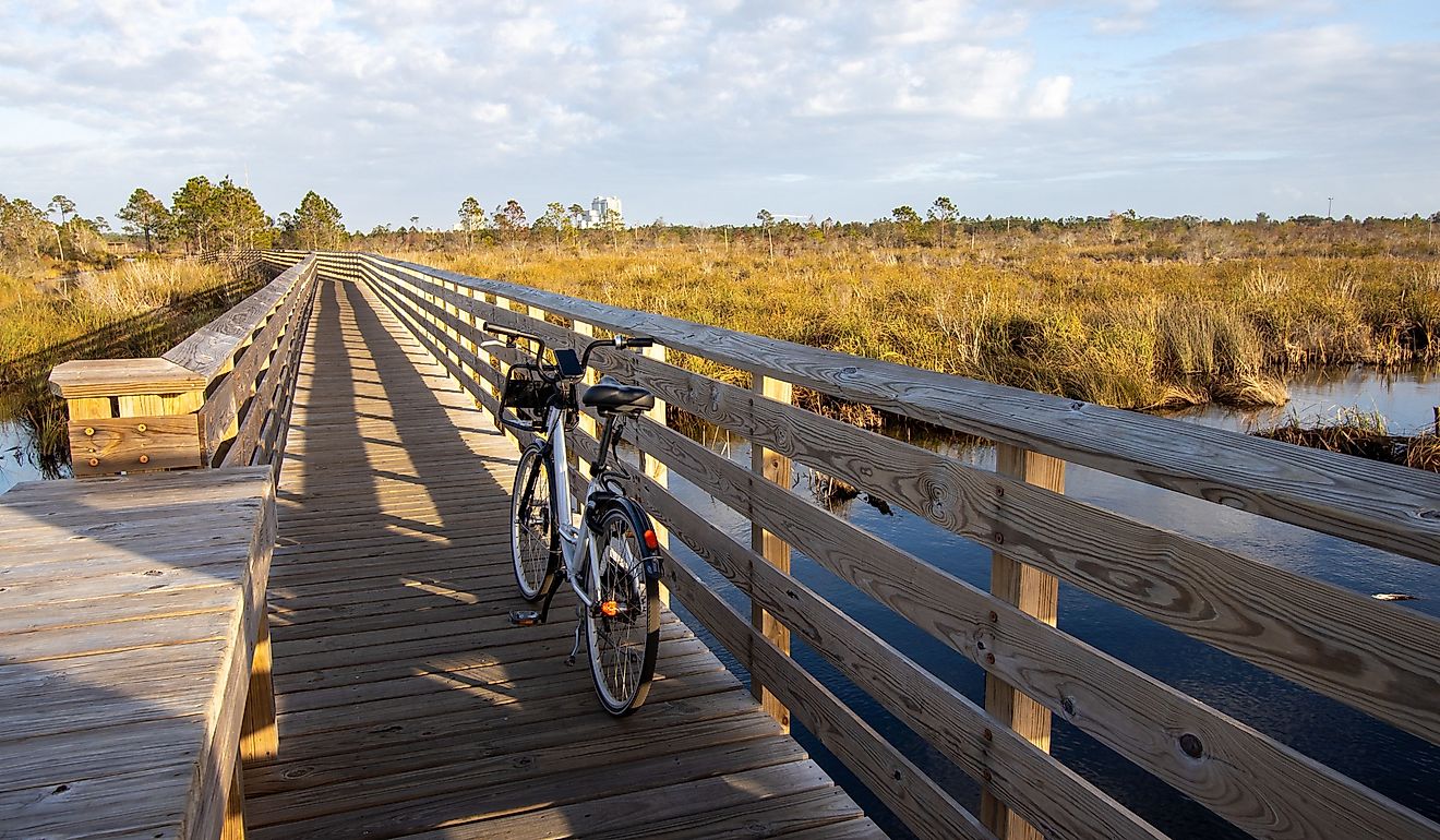 Bike on boardwalk at outlook for Shelby Lakes at Gulf State Park.