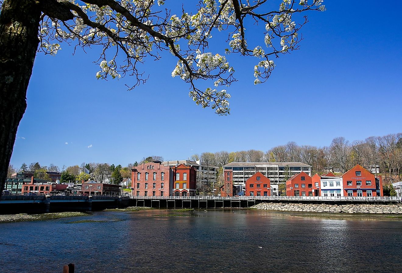 View from the Westport Bridge over Saugatuck River and architecture near downtown. Image credit Miro Vrlik Photography via Shutterstock.