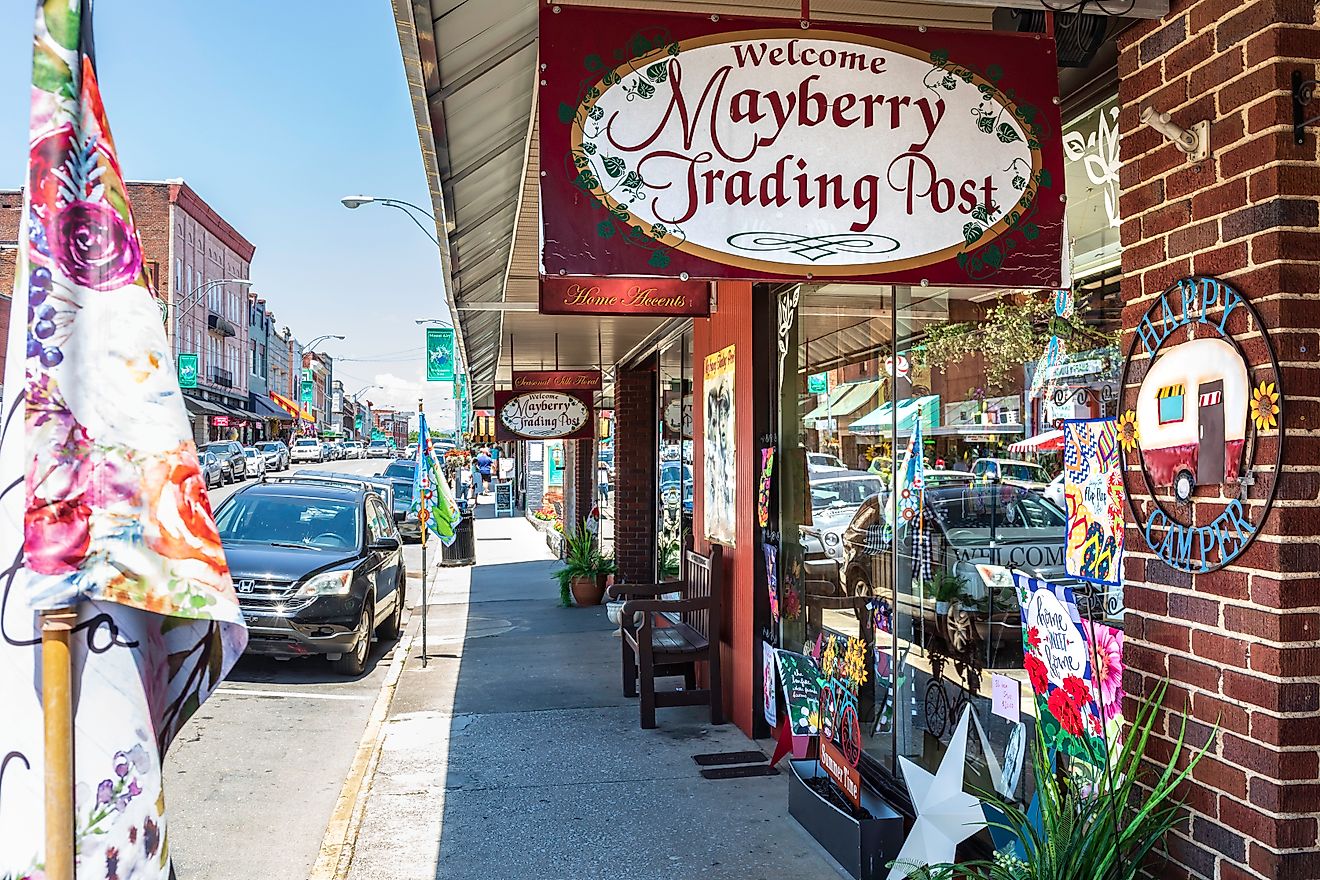 Mount Airy, North Carolina: A view down busy Main Street past the colorful Mayberry Trading Post, via J. Michael Jones / iStock.com