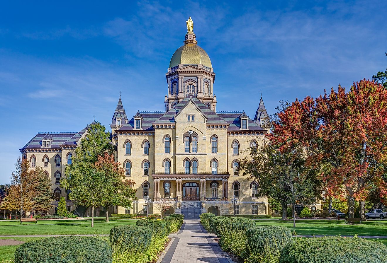 Main Administration Building known as the "Golden Dome" on the campus of Notre Dame University, Indiana in the fall. Image credit Ken Wolter via Shutterstock