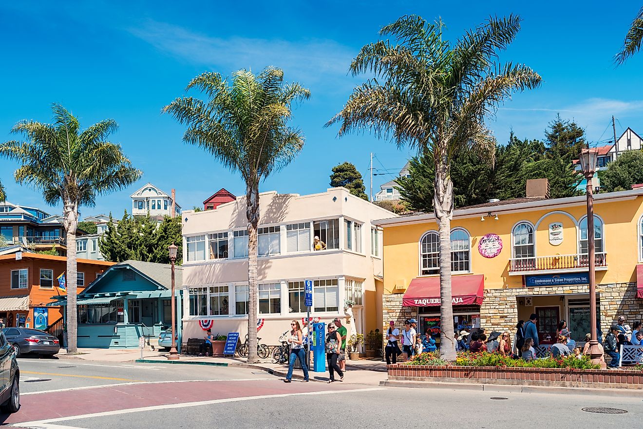 People enjoy a sunny day in downtown Capitola, California, via benedek / iStock.com