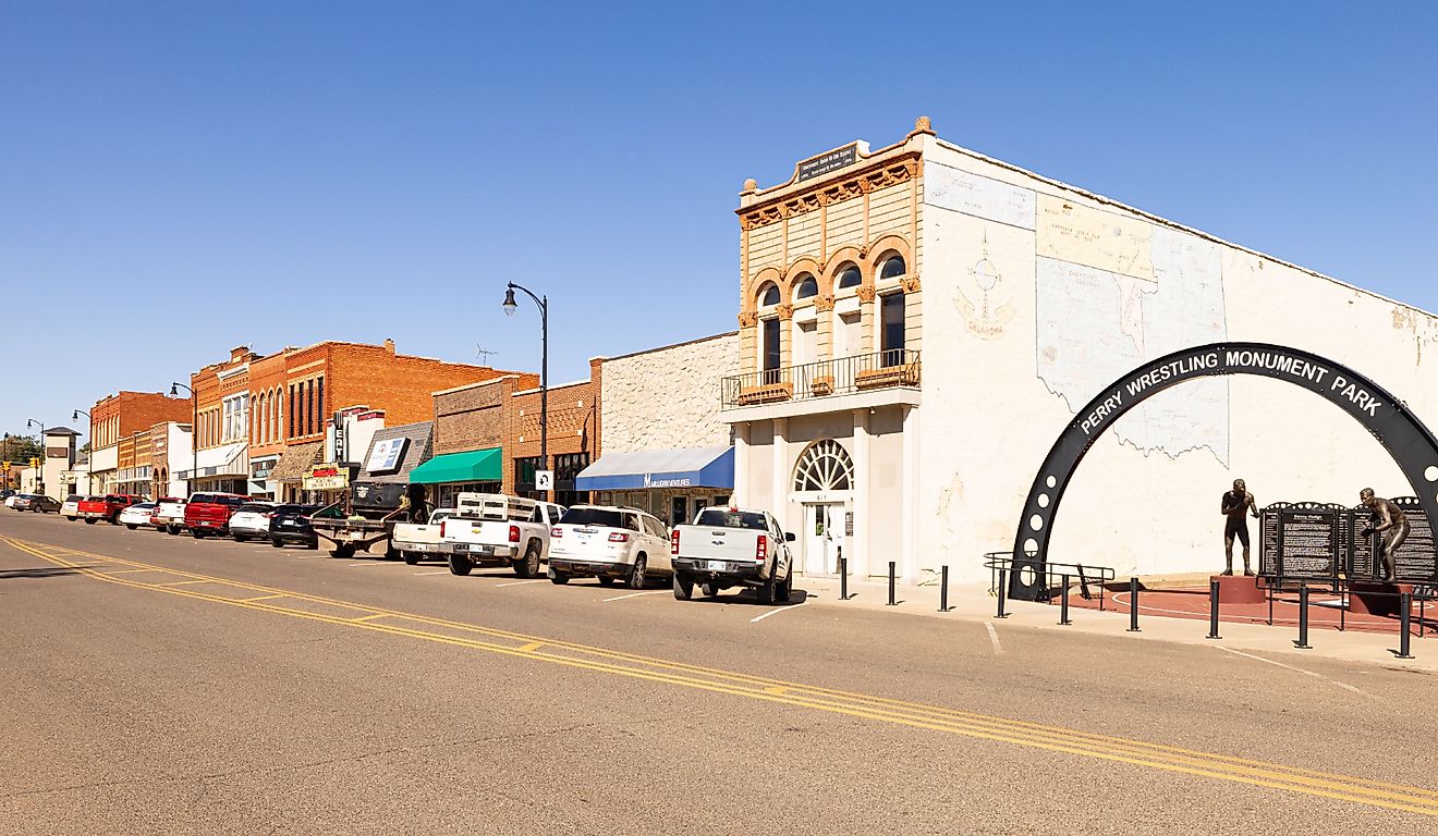 The Perry Wrestling Monument Park and the old business district on Delaware Street. Perry, Oklahoma. Editorial credit: Roberto Galan / Shutterstock.com